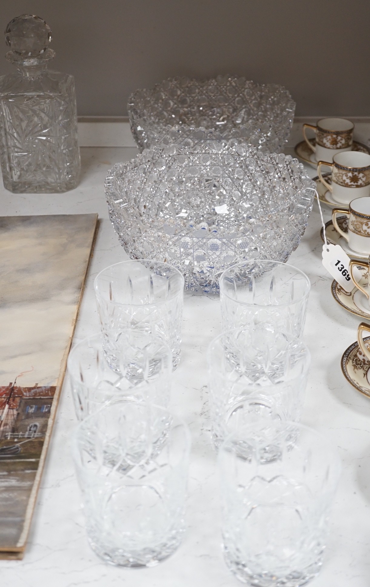 A Pair of Bohemian or Czech heavy cuts glass fruit bowls with blue flashed centres, 22.5 cm diameter, two decanters and six tumblers.